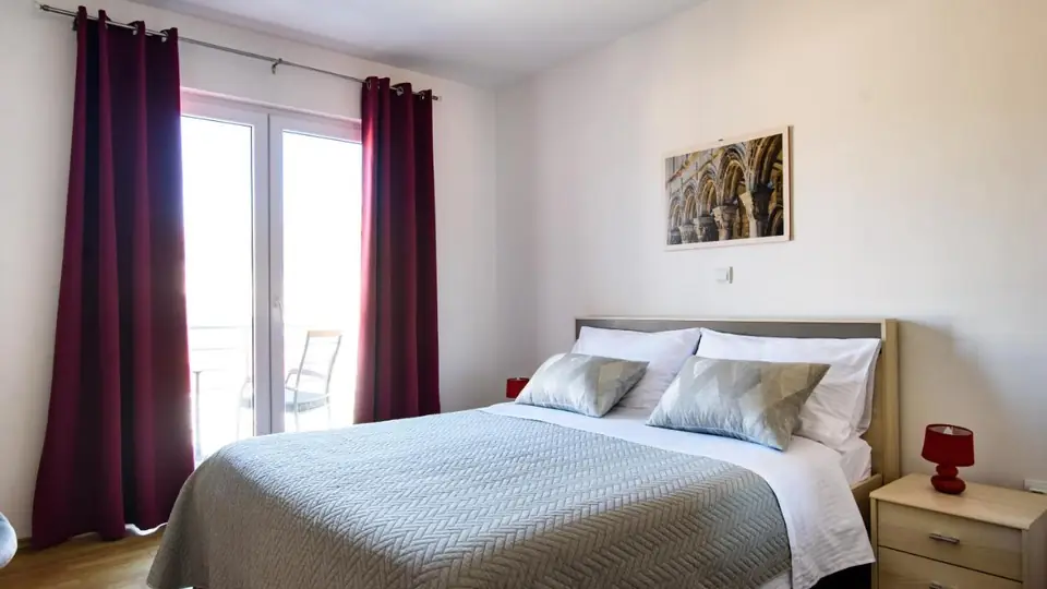 Bedroom of the Luxury One-Bedroom Apartment with Terrace at California Apartments, with the large double bed