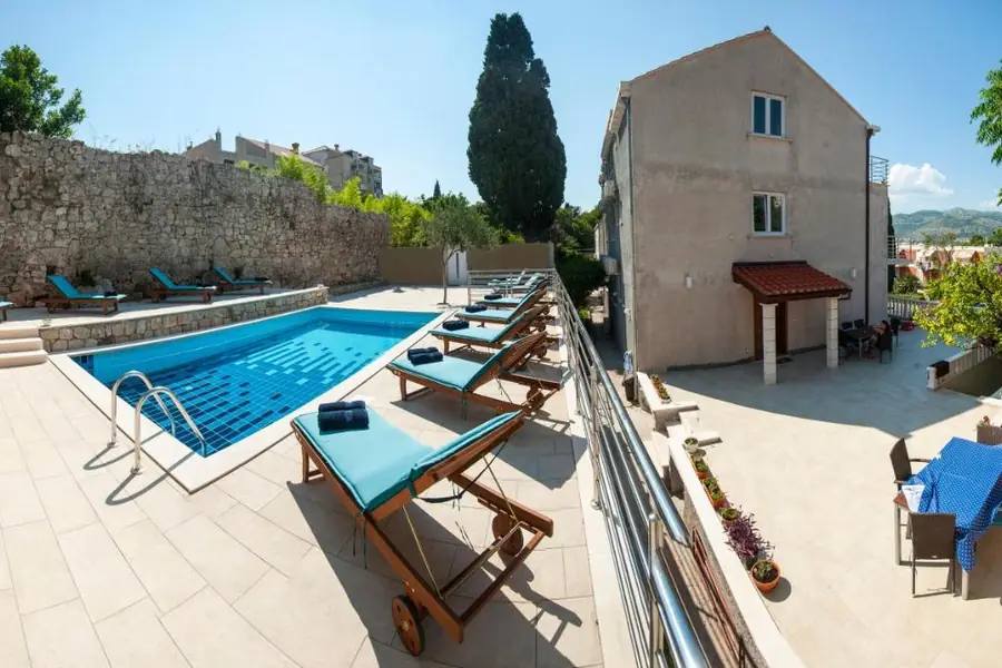 California Apartments building with the outdoor pool and sun loungers, in Lapad, Dubrovnik